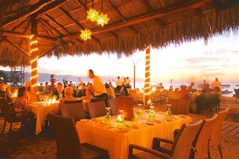 La palapa puerto vallarta - Enjoy a piña colada or a Bloody Mary with your feet in the sand at La Palapa, a restaurant with a long history in Vallarta. Order chilaquiles, huevos rancheros, or pancakes …